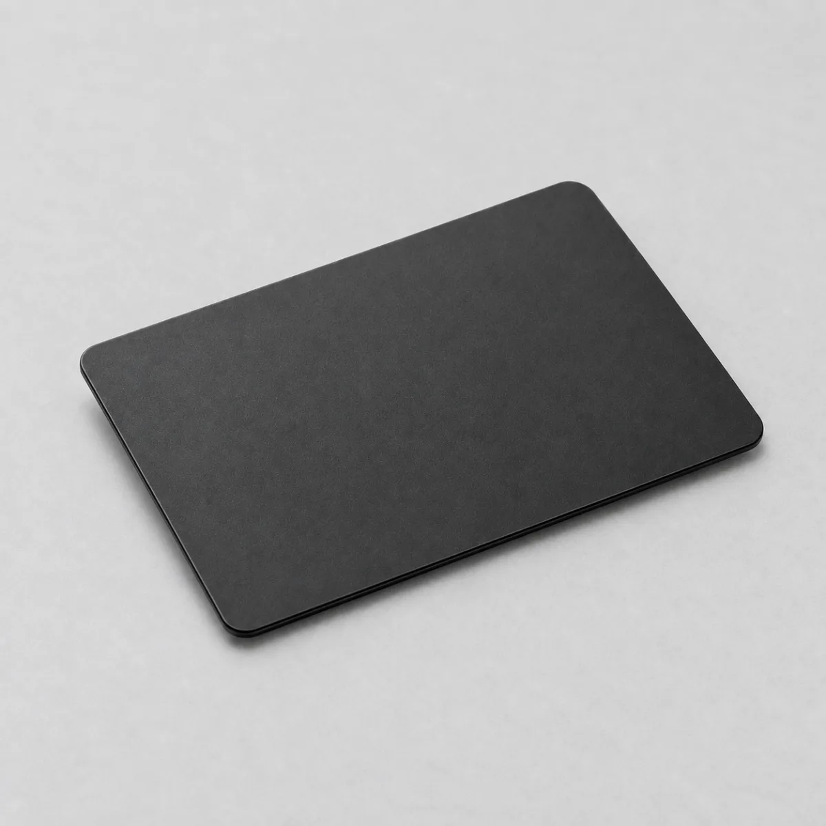 A plain matte black tap card